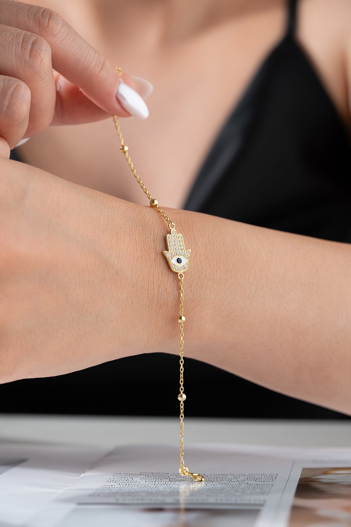 Vergoldetes Armband mit Hamsa-Hand & Auge