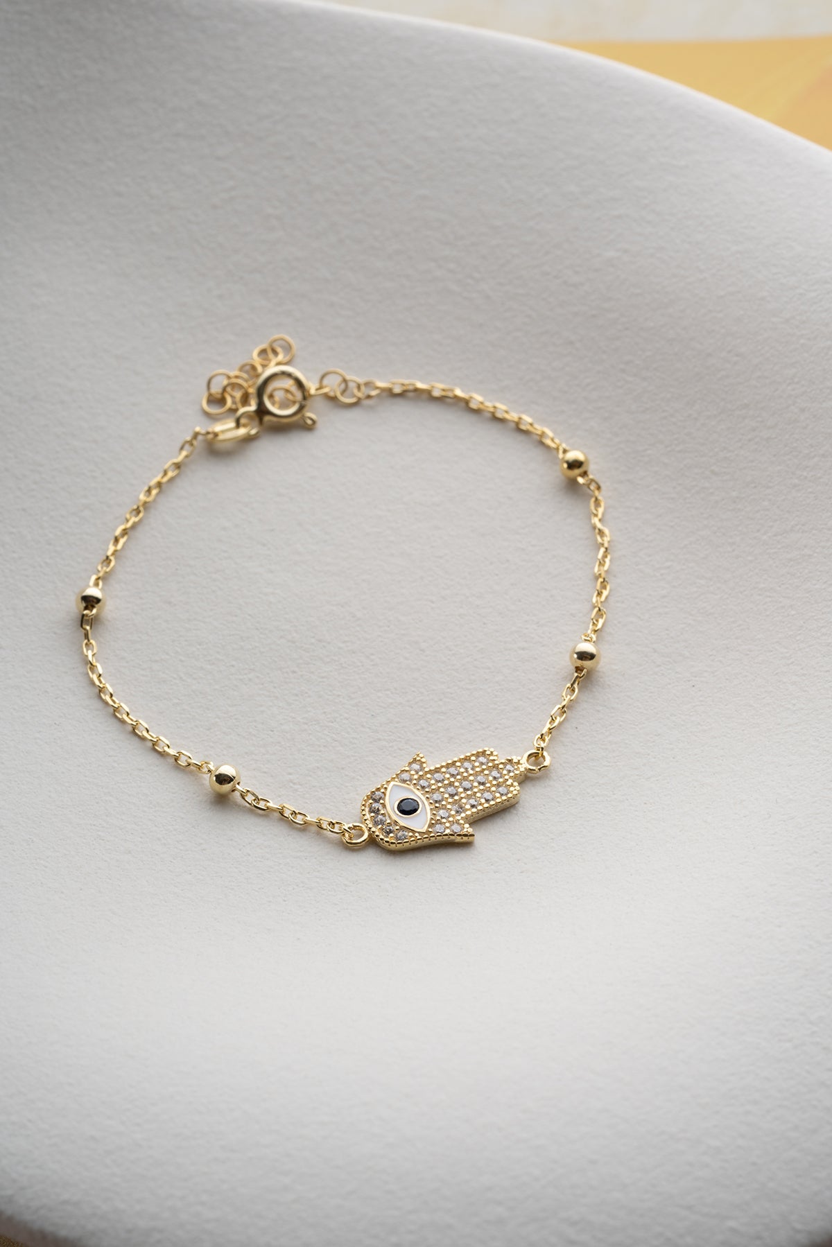 Vergoldetes Armband mit Hamsa-Hand & Auge
